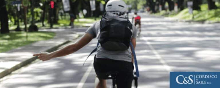 A bicyclist use the hand signal