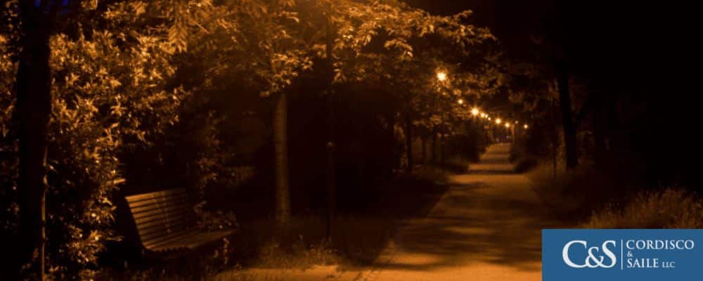 A sidewalk at night