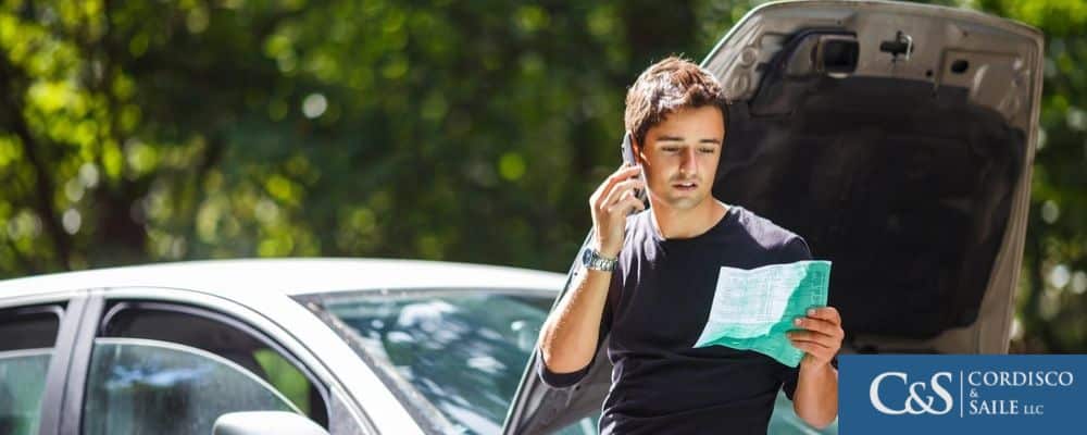 man on phone after car accident