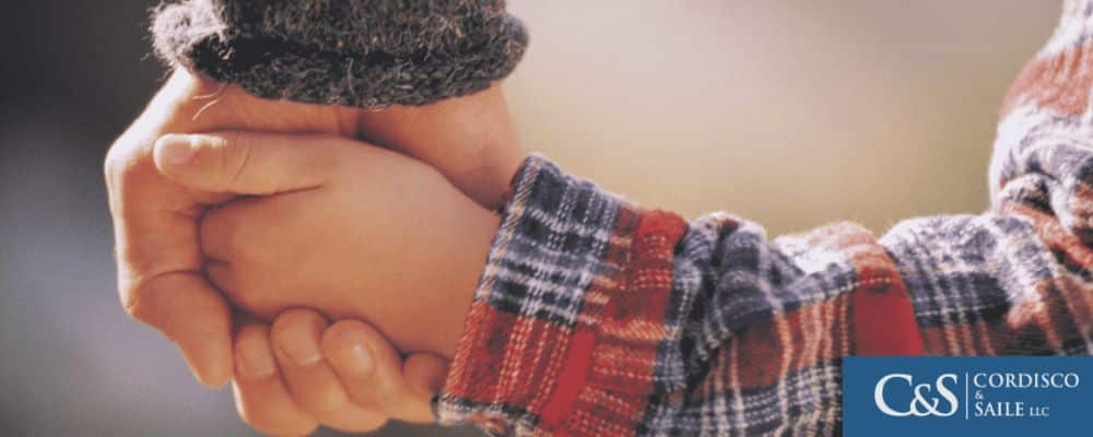 Parent holding a child hands