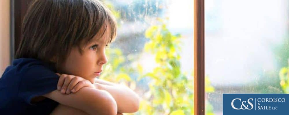 Child sitting by the window