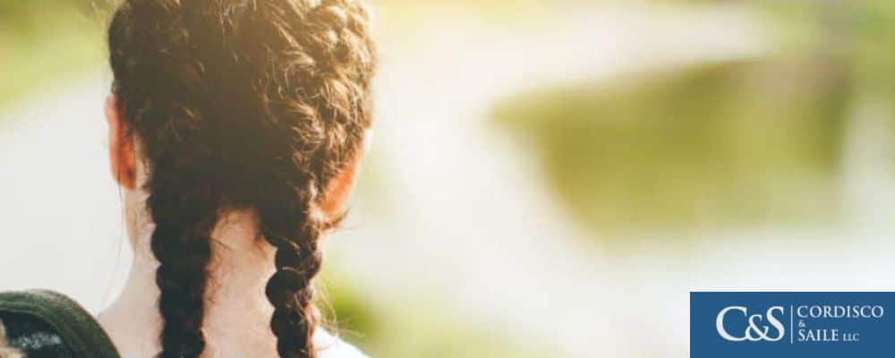 A young girl walking outside