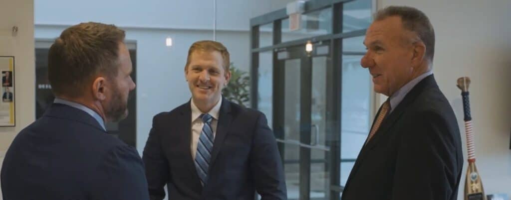 attorneys talking in office lobby