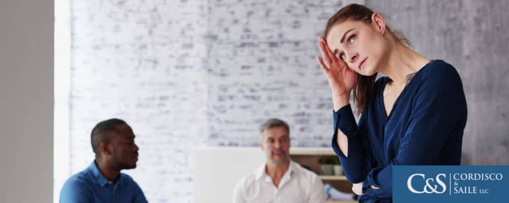 woman stressed out by coworkers discussion