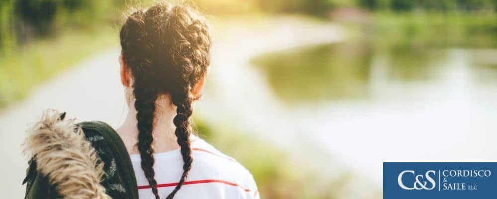 young person walking outside