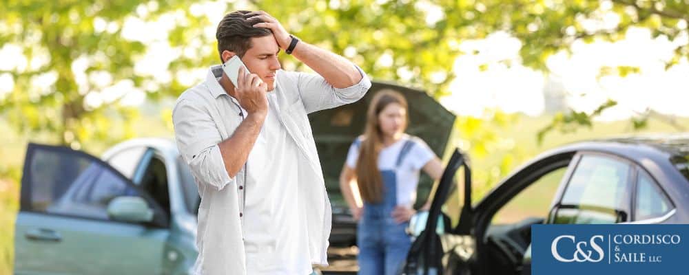 person on phone after a car accident that wasn't their fault